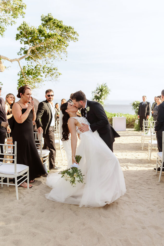 couple kissing during ceremony