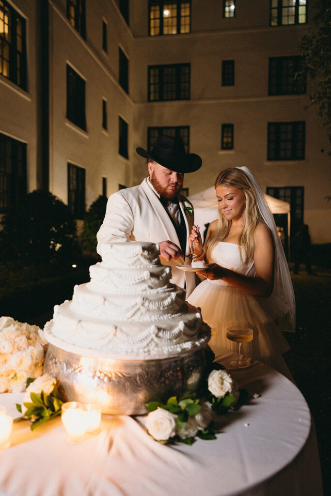 wedding cake cutting moment from a spanish moss wedding