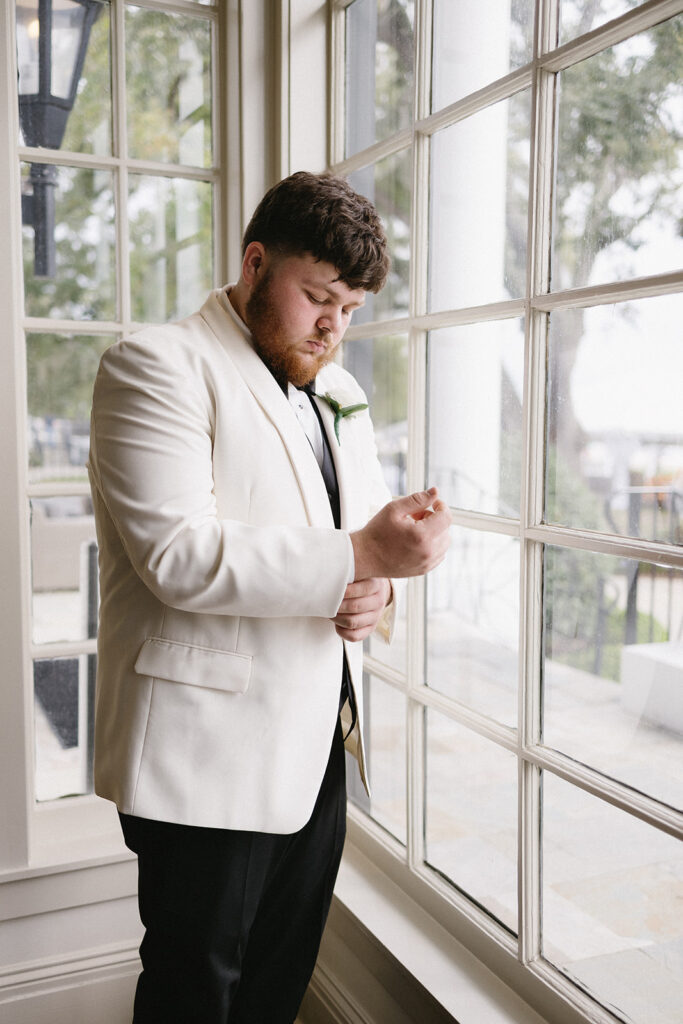 groom getting ready for wedding from a spanish moss wedding