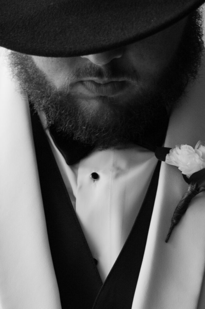 groom getting ready for wedding from a spanish moss wedding