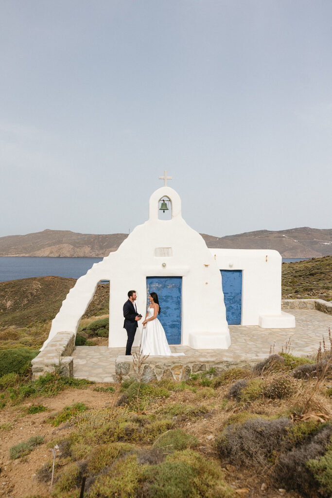 couple posing in greece for wedding photos
