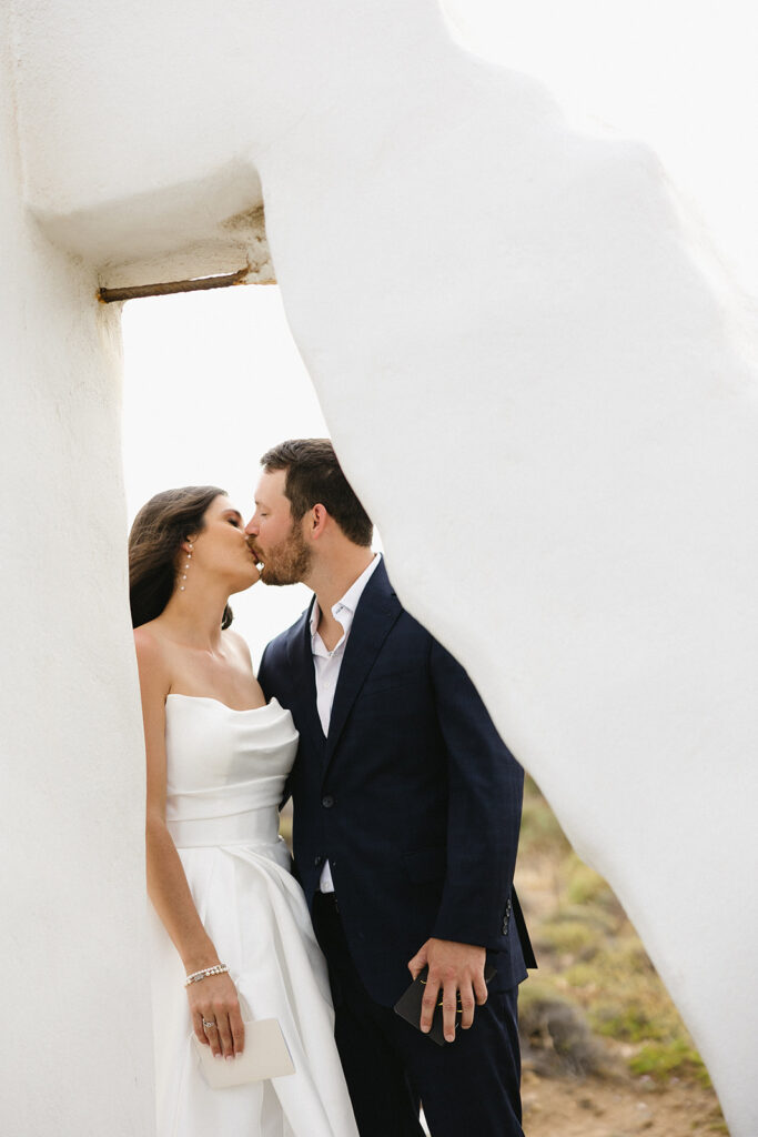 couple posing in greece for wedding photos
