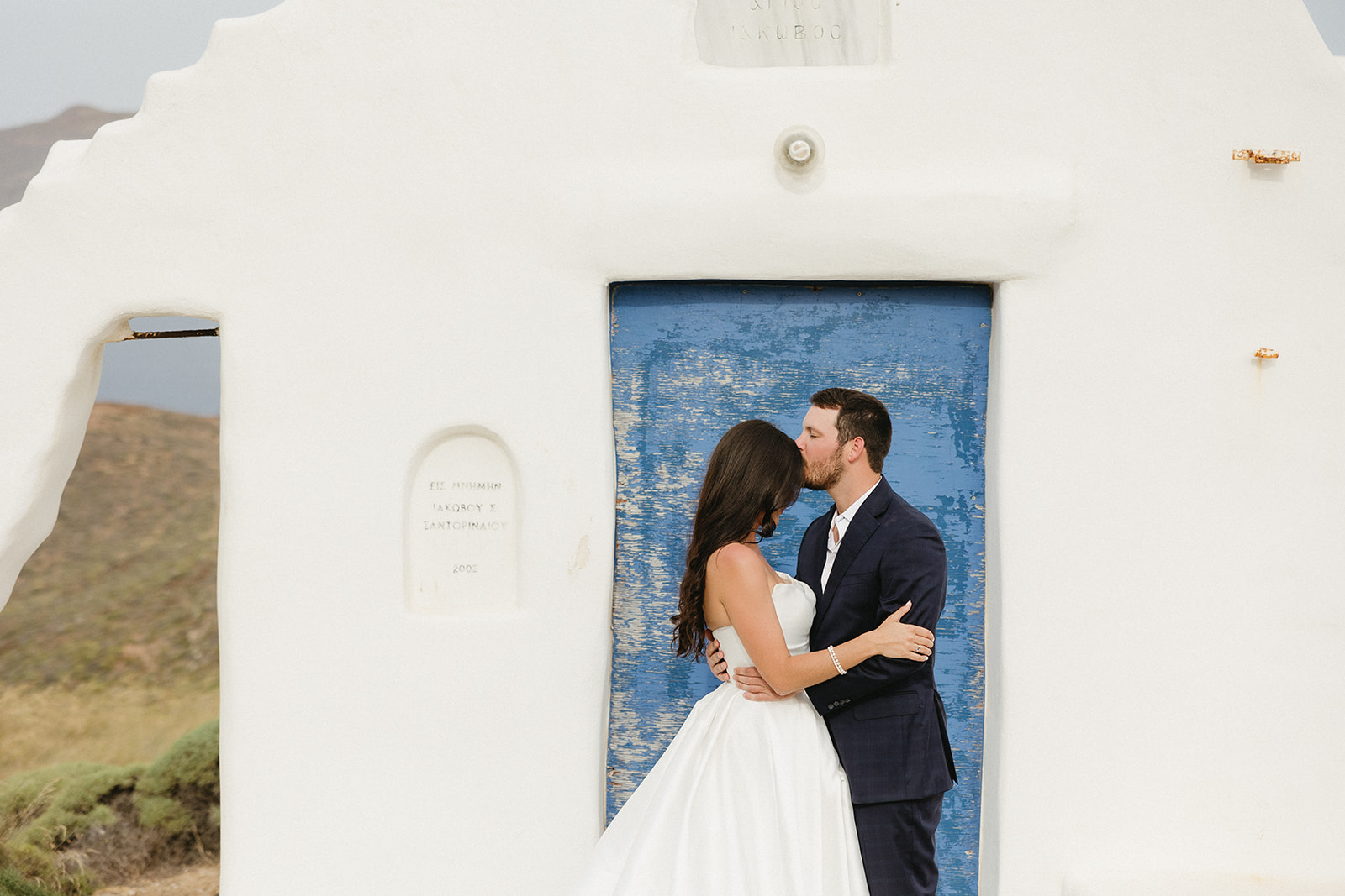 couple posing in greece for wedding photos