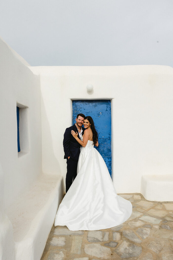 couple posing in greece for wedding photos
