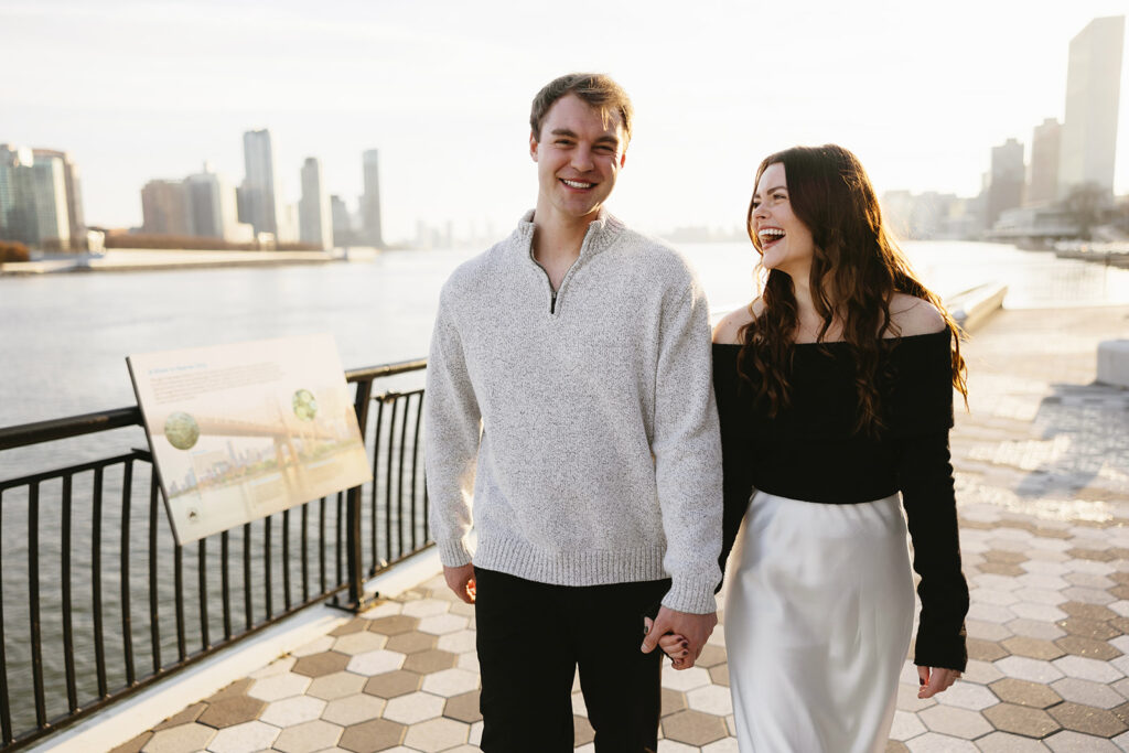 Two people in love posing for modern engagement photos in the heart of NYC, capturing their connection in a natural way.