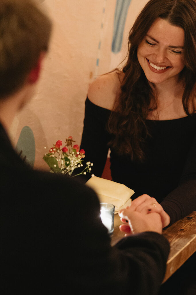 A couple sharing a candid moment during their engagement session in New York City, surrounded by the energy of the streets.
