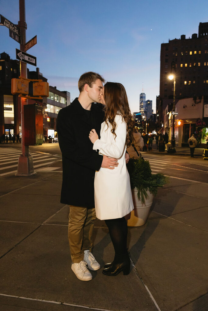 A couple sharing a candid moment during their engagement session in New York City, surrounded by the energy of the streets.
