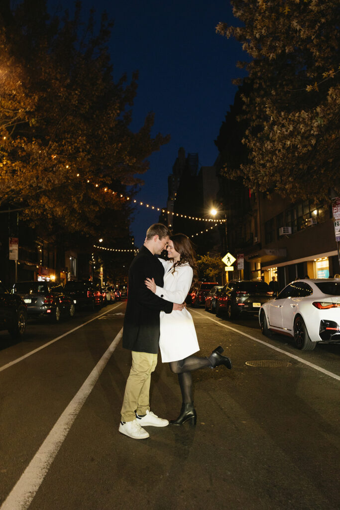 A couple sharing a candid moment during their engagement session in New York City, surrounded by the energy of the streets.
