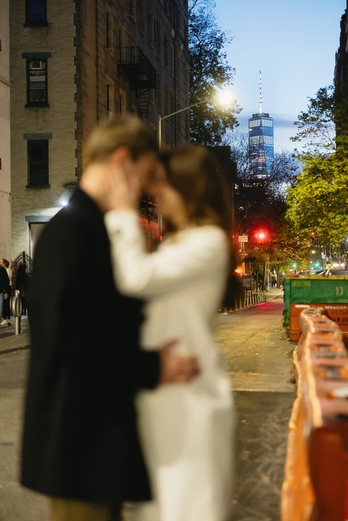 A couple sharing a candid moment during their engagement session in New York City, surrounded by the energy of the streets.
