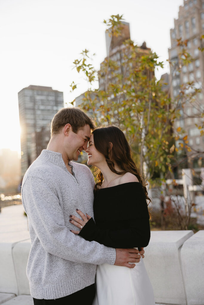 A couple sharing a candid moment during their engagement session in New York City, surrounded by the energy of the streets.
