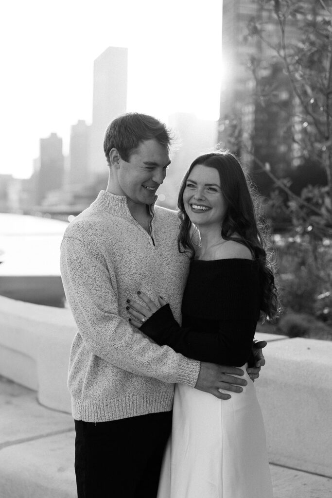 A couple sharing a candid moment during their engagement session in New York City, surrounded by the energy of the streets.
