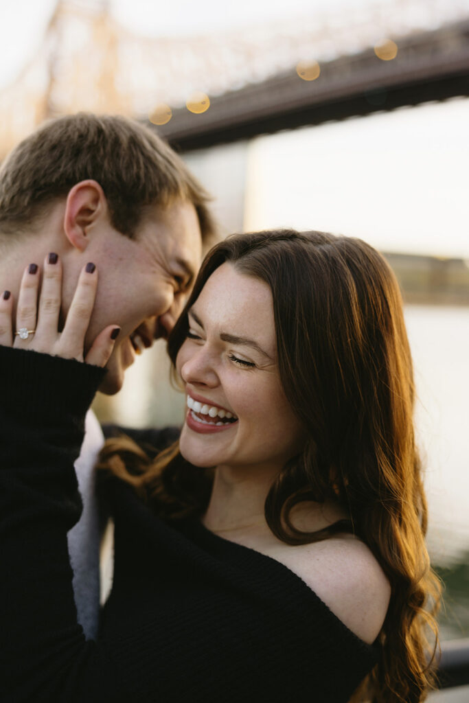 A couple enjoying a relaxed and stylish engagement shoot in New York City, with the city as their backdrop.
