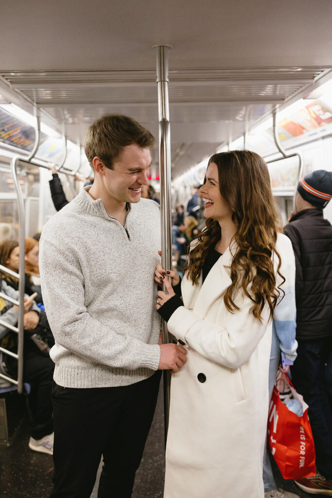 A couple sharing a candid moment during their engagement session in New York City, surrounded by the energy of the streets.