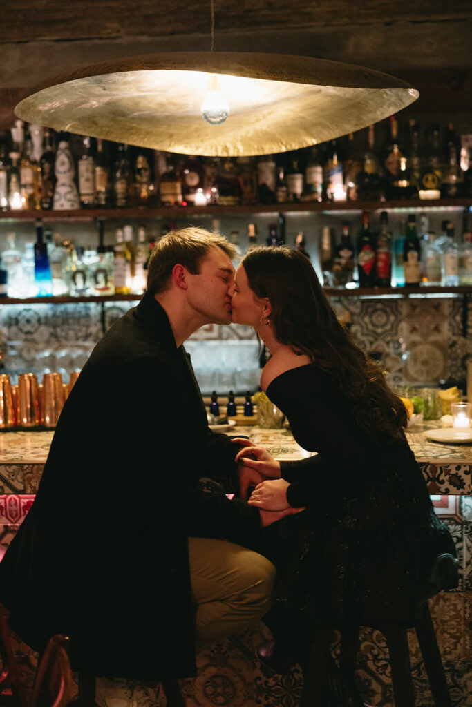 Two people in love posing for modern engagement photos in the heart of NYC, capturing their connection in a natural way.
