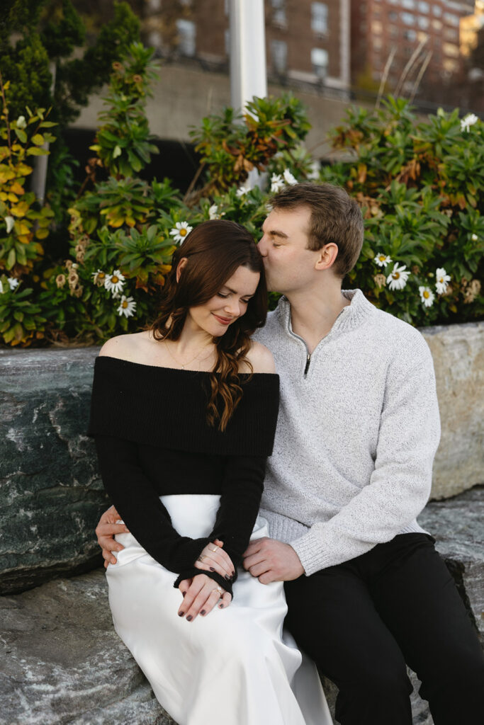 A couple sharing a candid moment during their engagement session in New York City, surrounded by the energy of the streets.
