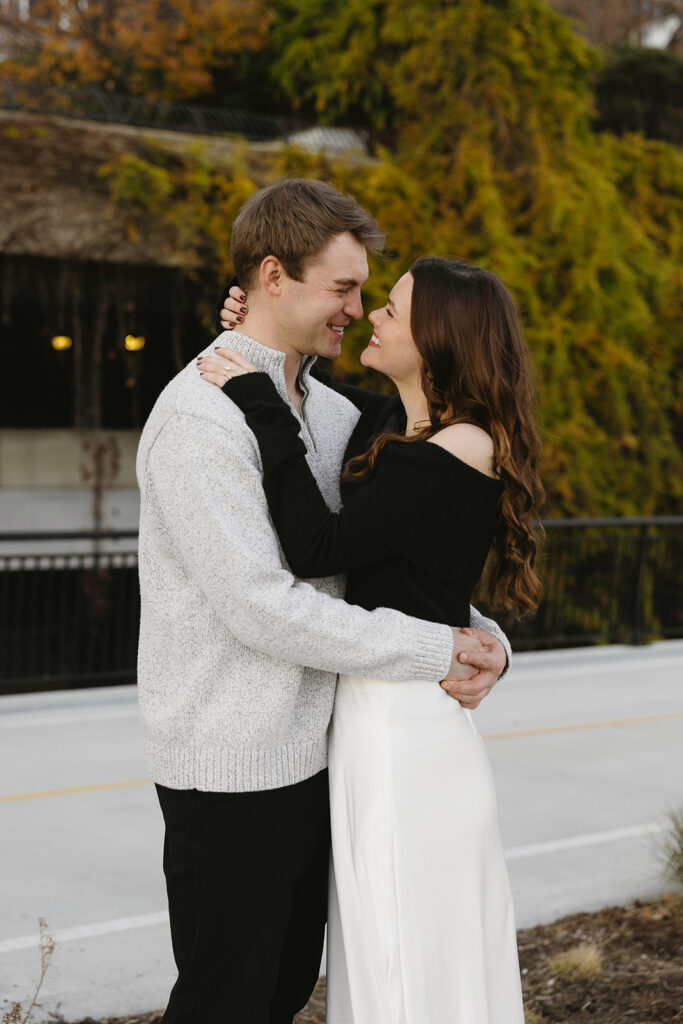 A couple sharing a candid moment during their engagement session in New York City, surrounded by the energy of the streets.
