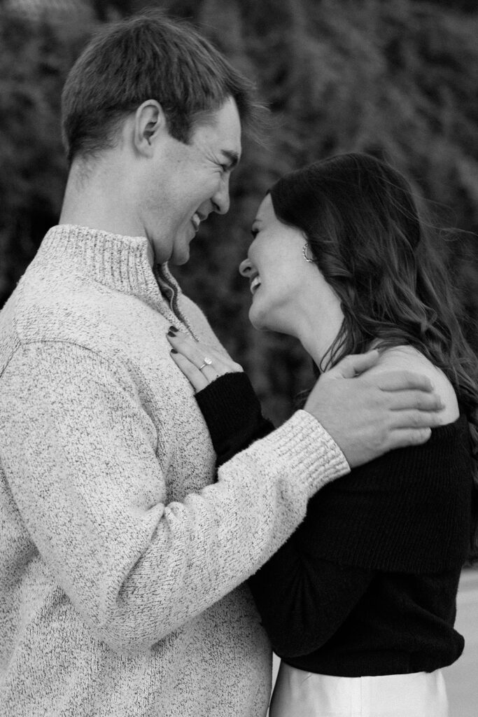 A couple sharing a candid moment during their engagement session in New York City, surrounded by the energy of the streets.
