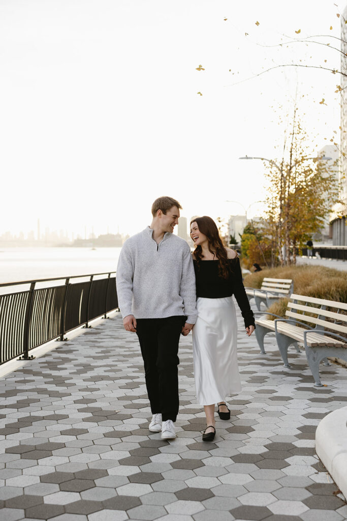 A couple sharing a candid moment during their engagement session in New York City, surrounded by the energy of the streets.
