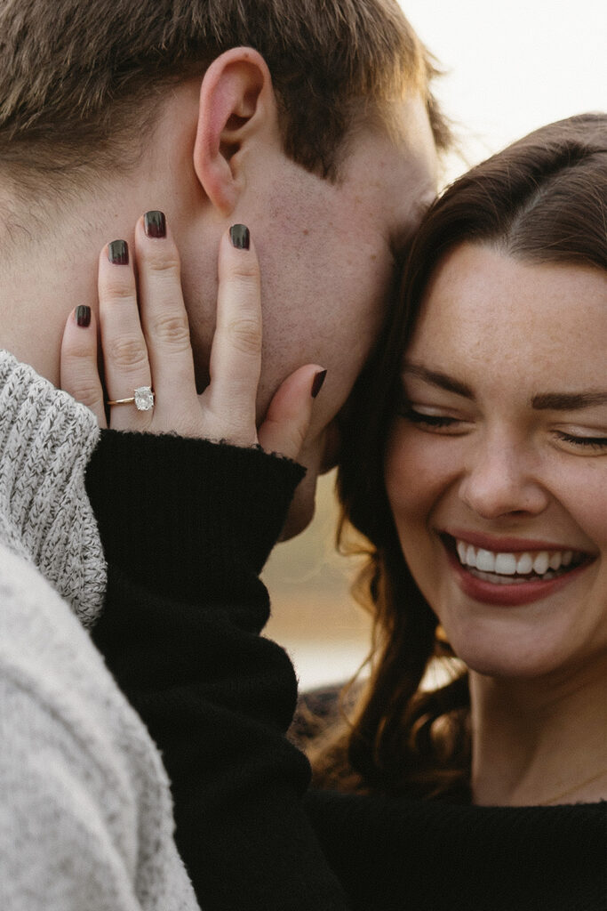 Two people in love posing for modern engagement photos in the heart of NYC, capturing their connection in a natural way.
