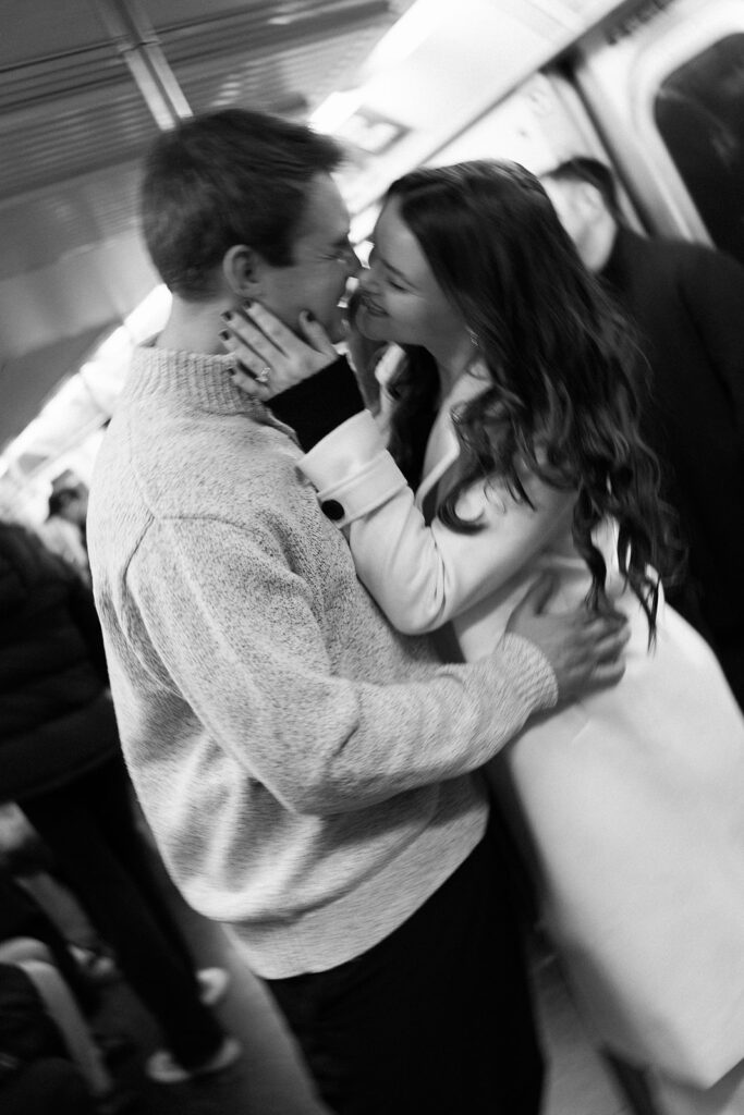 Two people in love posing for modern engagement photos in the heart of NYC, capturing their connection in a natural way.