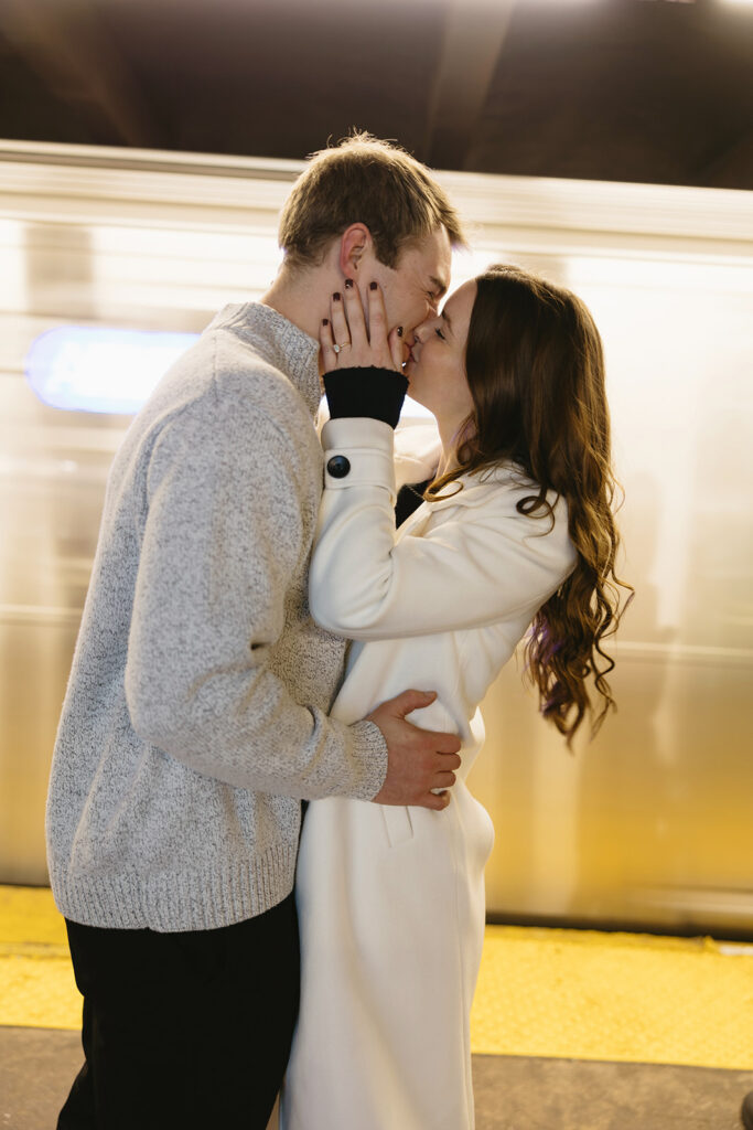 A couple enjoying a relaxed and stylish engagement shoot in New York City, with the city as their backdrop.
