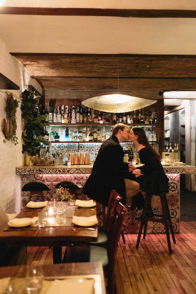 Two people in love posing for modern engagement photos in the heart of NYC, capturing their connection in a natural way.
