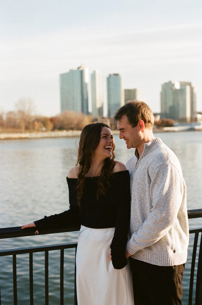 A couple enjoying a relaxed and stylish engagement shoot in New York City, with the city as their backdrop.
