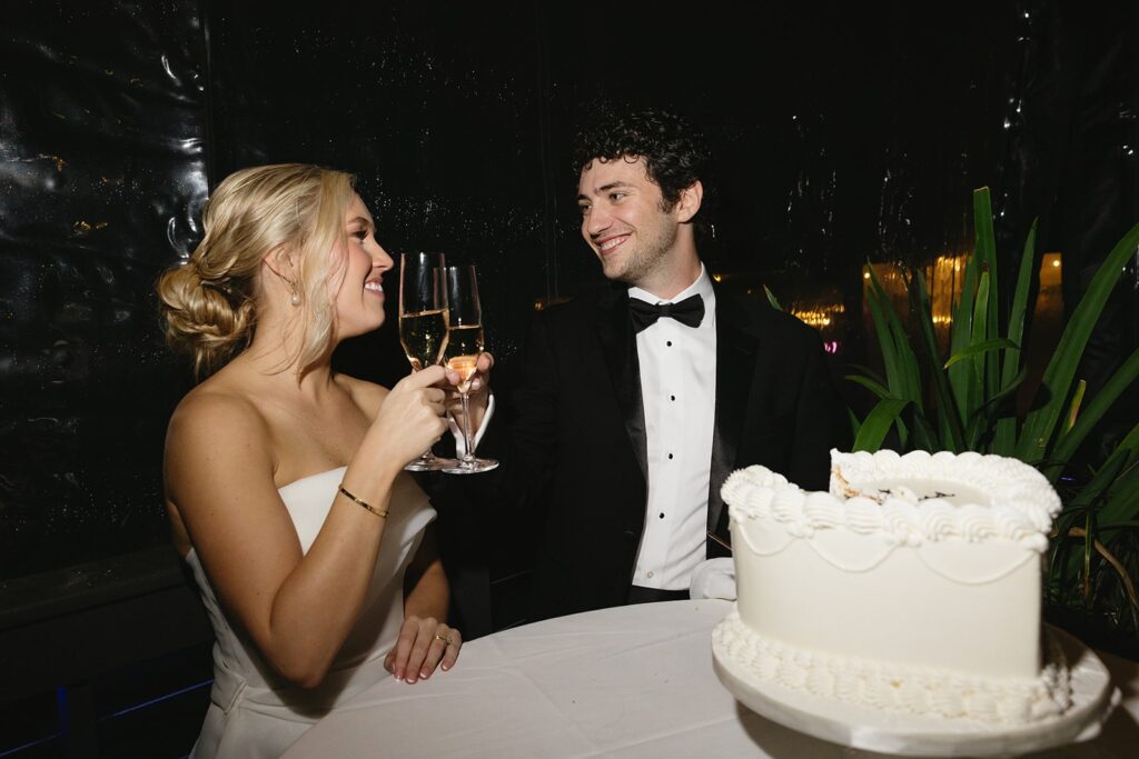 Bride and groom cutting their wedding cake