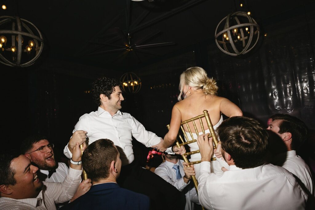 bride and groom dancing during their rainy day wedding reception.