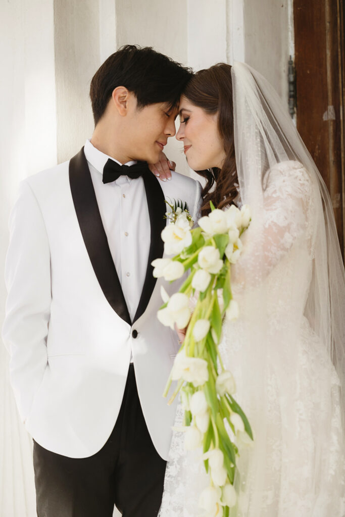 Couple posing for romantic wedding portraits
