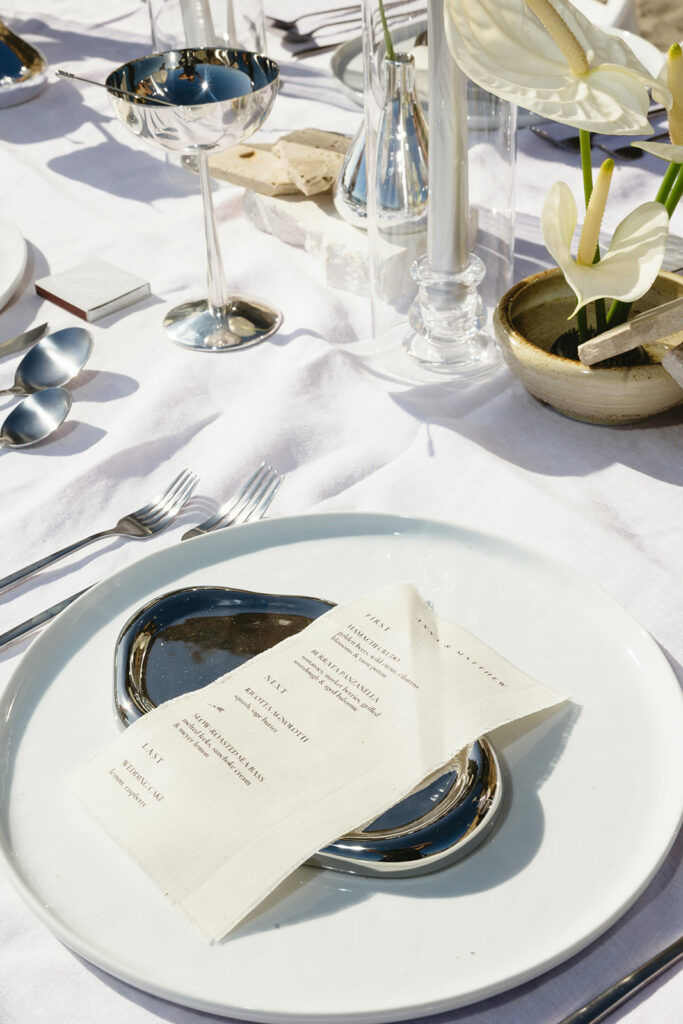 Contemporary beach wedding table setting at Corona Del Mar with neutral tones
