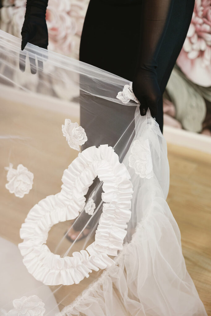Bride wearing a custom heart veil made from her mother’s veil

